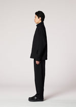 A model wears the IM MEN SHRINK JACQUARD clothing.