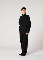 A model wears the IM MEN SHRINK JACQUARD clothing.