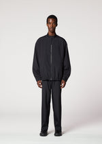 A model wears the IM MEN AIR PLEATS jacket.