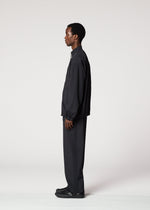 A model wears the IM MEN AIR PLEATS jacket.