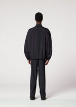 A model wears the IM MEN AIR PLEATS jacket.
