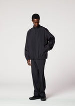 A model wears the IM MEN AIR PLEATS jacket.