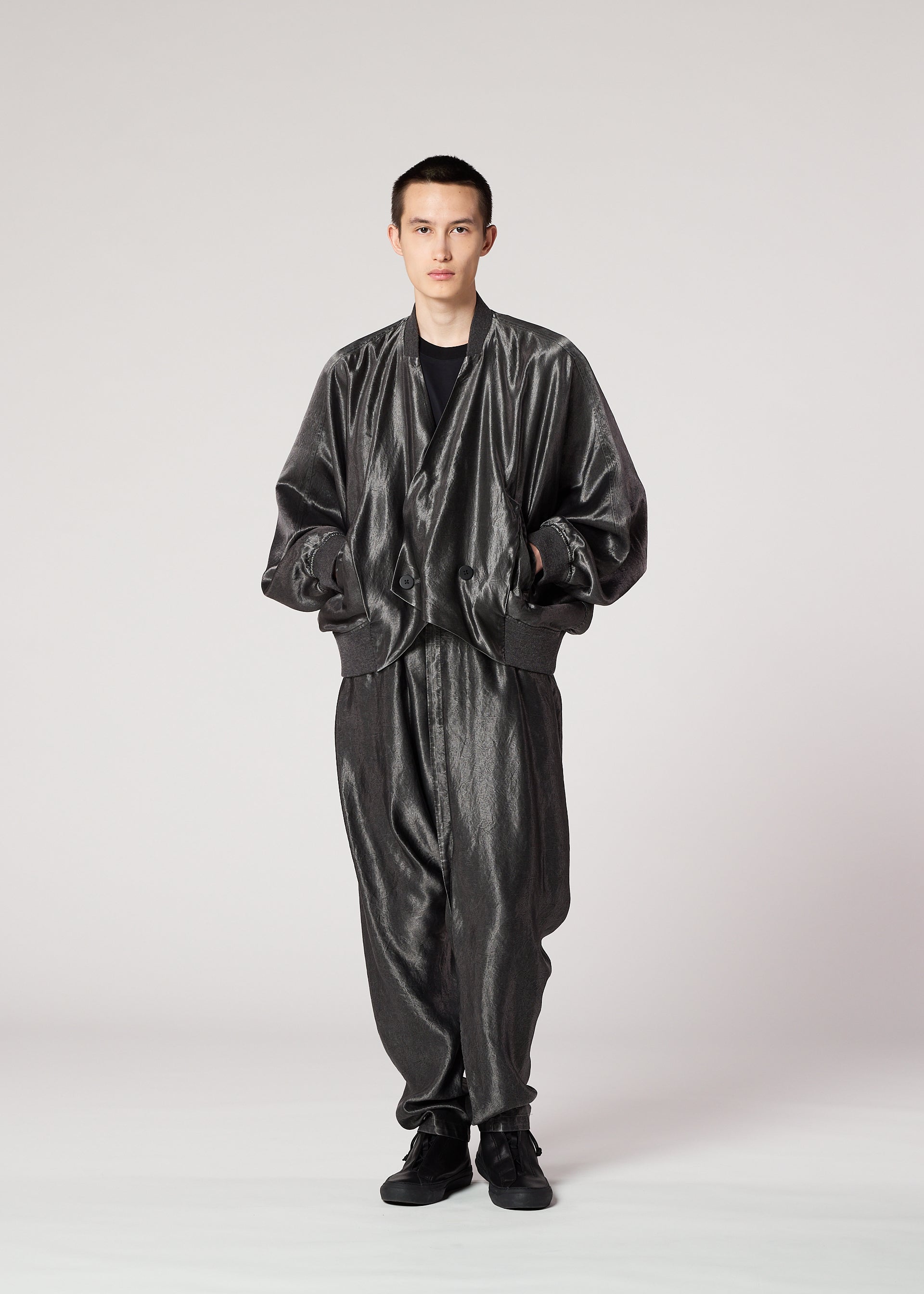A model wears the IM MEN SATIN WASH jacket.