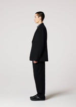 A model wears the IM MEN SHRINK JACQUARD clothing.