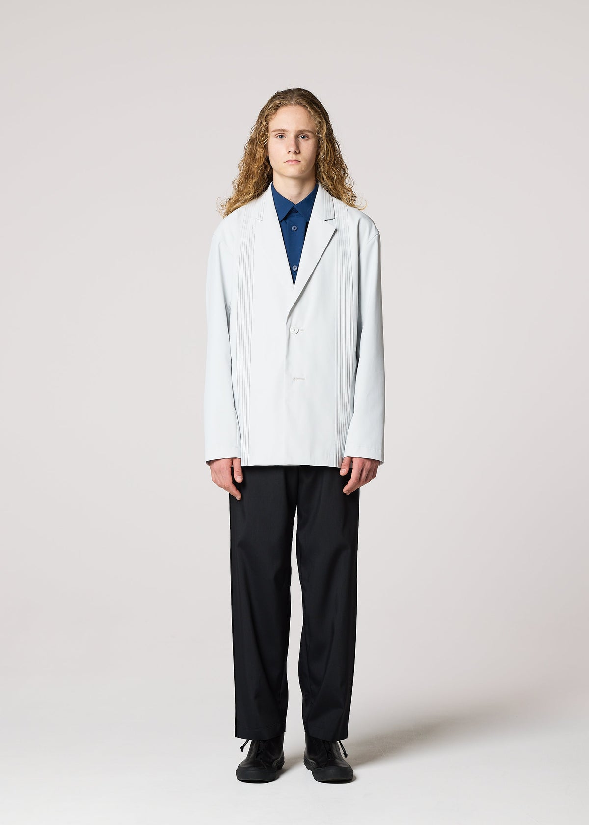 A model wears the IM MEN AIR PLEATS jacket.