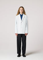 A model wears the IM MEN AIR PLEATS jacket.