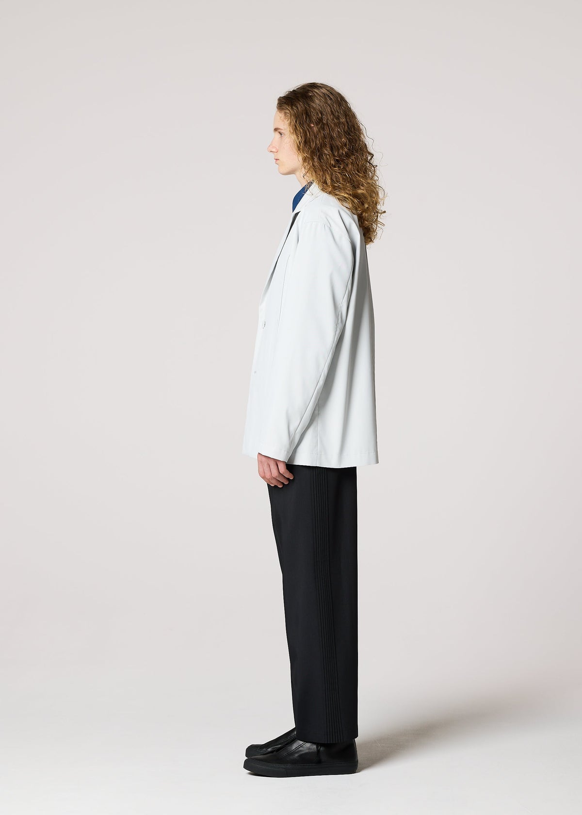 A model wears the IM MEN AIR PLEATS jacket.