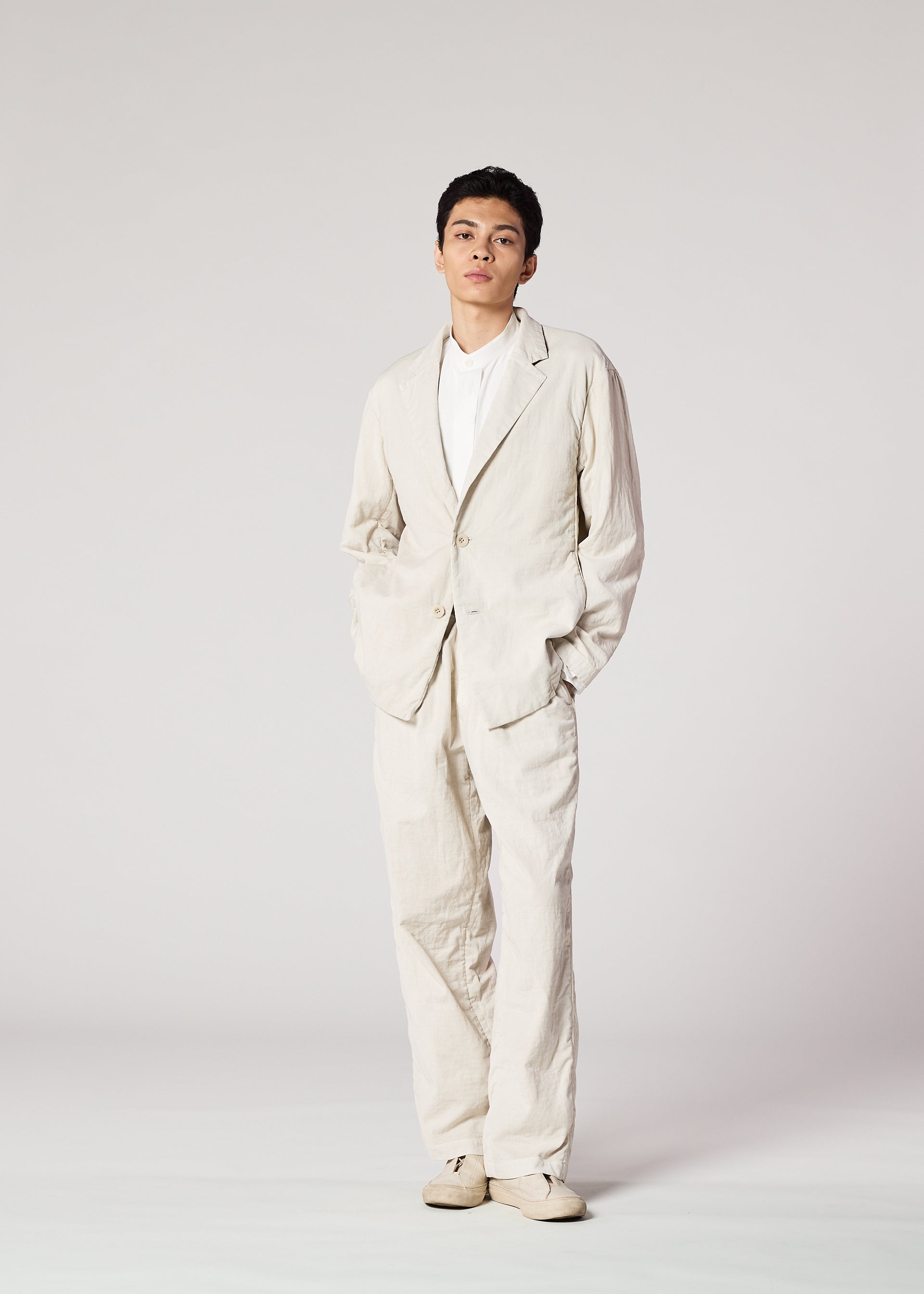 A model wears the IM MEN PIGMENT DOUBLE FACE COTTON jacket.