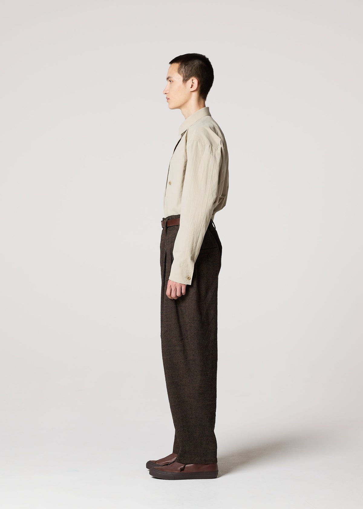 A model wears the IM MEN TEXTURES clothing.