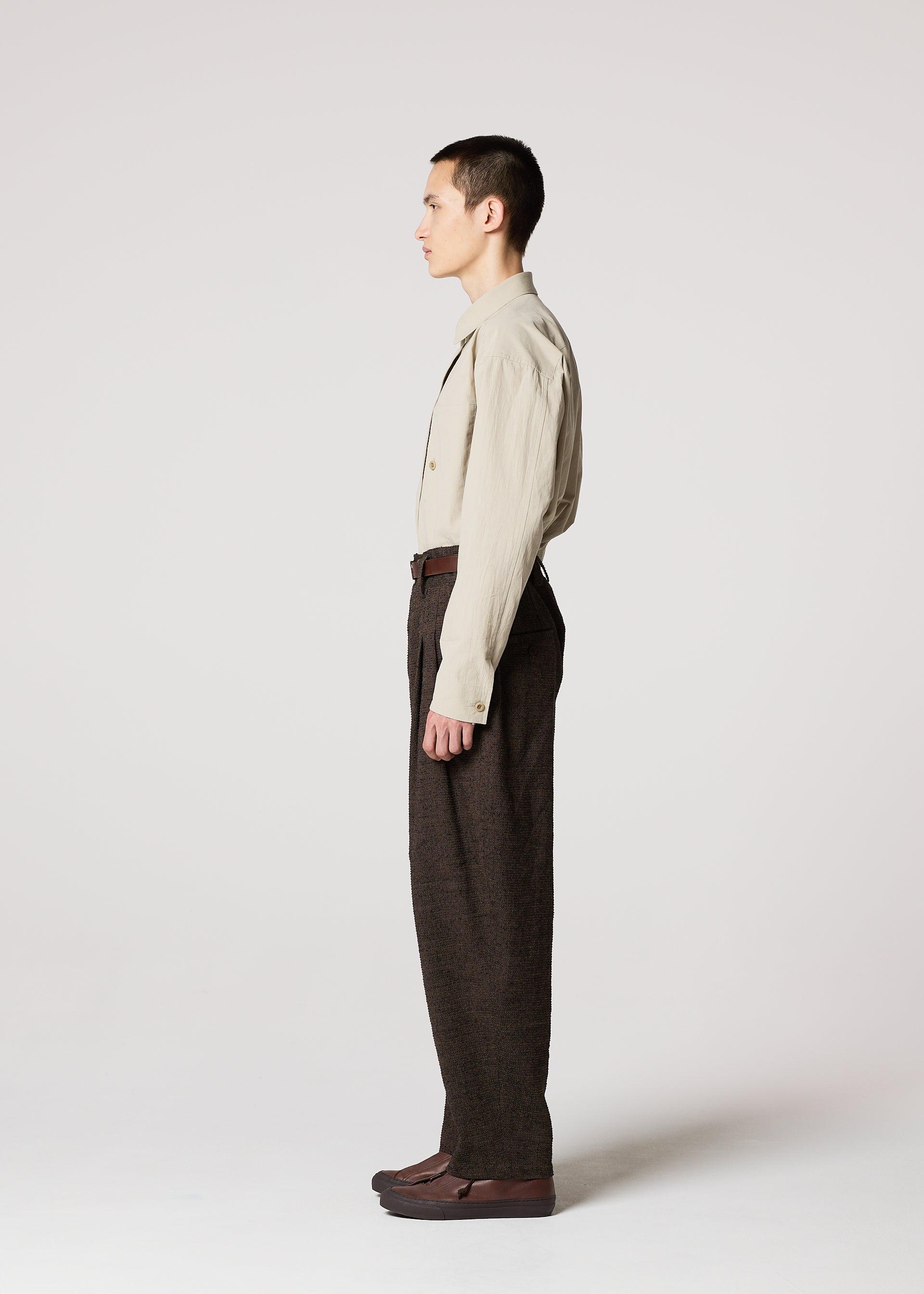 A model wears the IM MEN TEXTURES clothing.