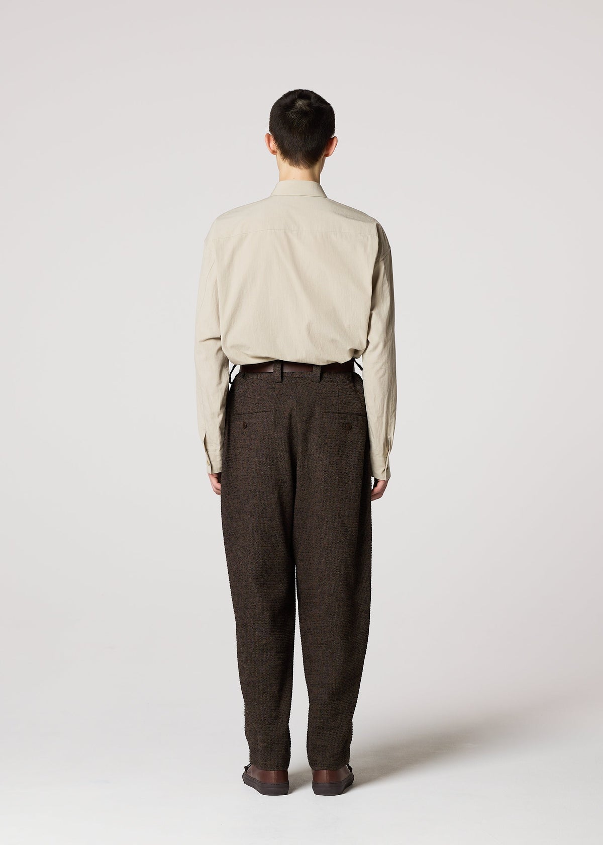 A model wears the IM MEN TEXTURES clothing.