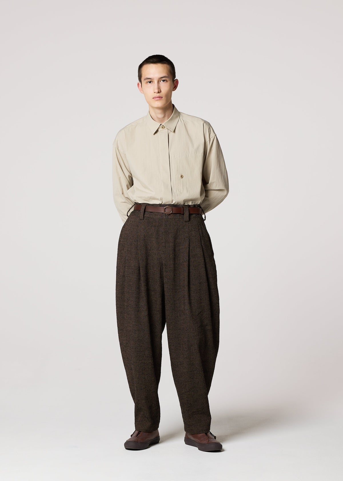 A model wears the IM MEN TEXTURES clothing.