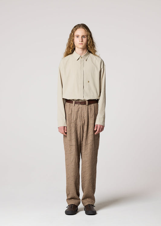 A model wears the IM MEN SHRINK JACQUARD clothing.