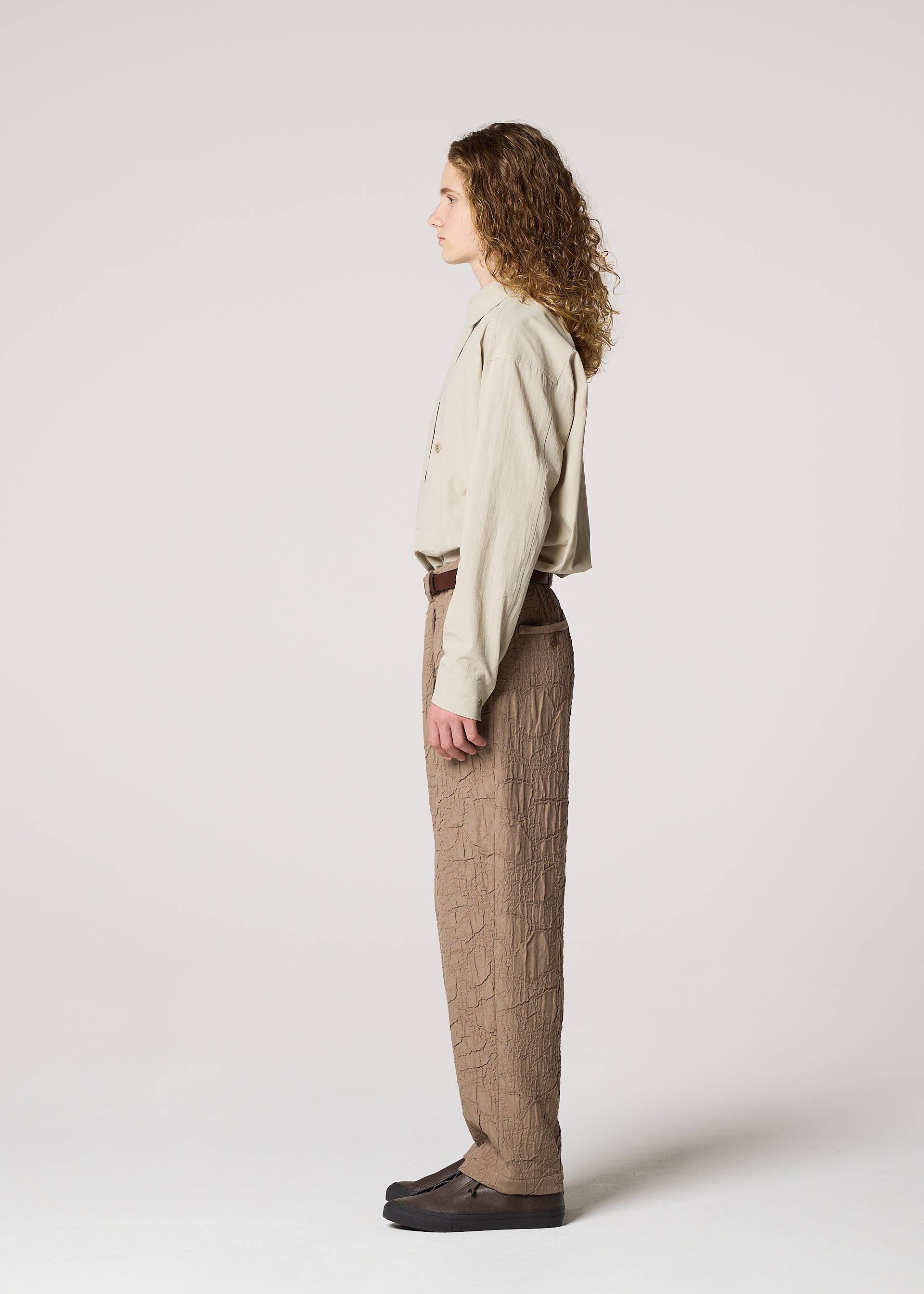 A model wears the IM MEN SHRINK JACQUARD clothing.