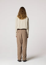 A model wears the IM MEN SHRINK JACQUARD clothing.