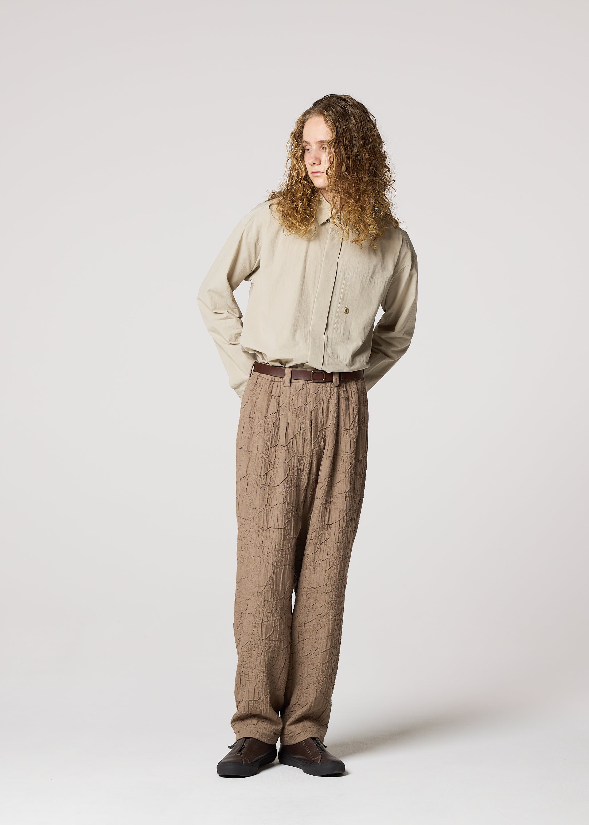 A model wears the IM MEN SHRINK JACQUARD clothing.