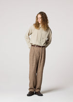 A model wears the IM MEN SHRINK JACQUARD clothing.