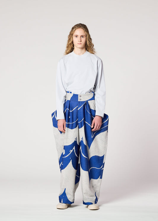 A model wears the IM MEN INLAY trousers.