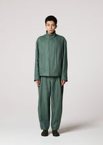 A model wears the IM MEN TOUGH LINEN trousers.