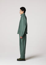 A model wears the IM MEN TOUGH LINEN trousers.