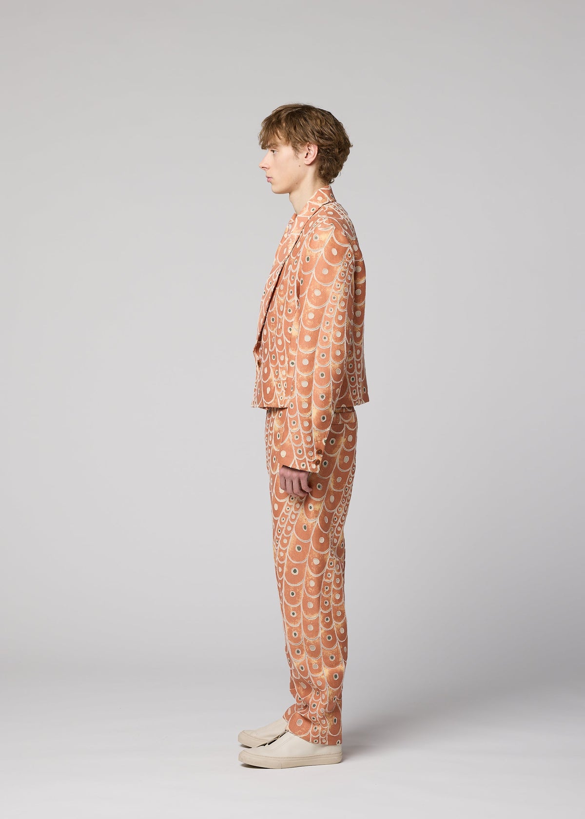 A model wears the IM MEN UROKOMON trousers.