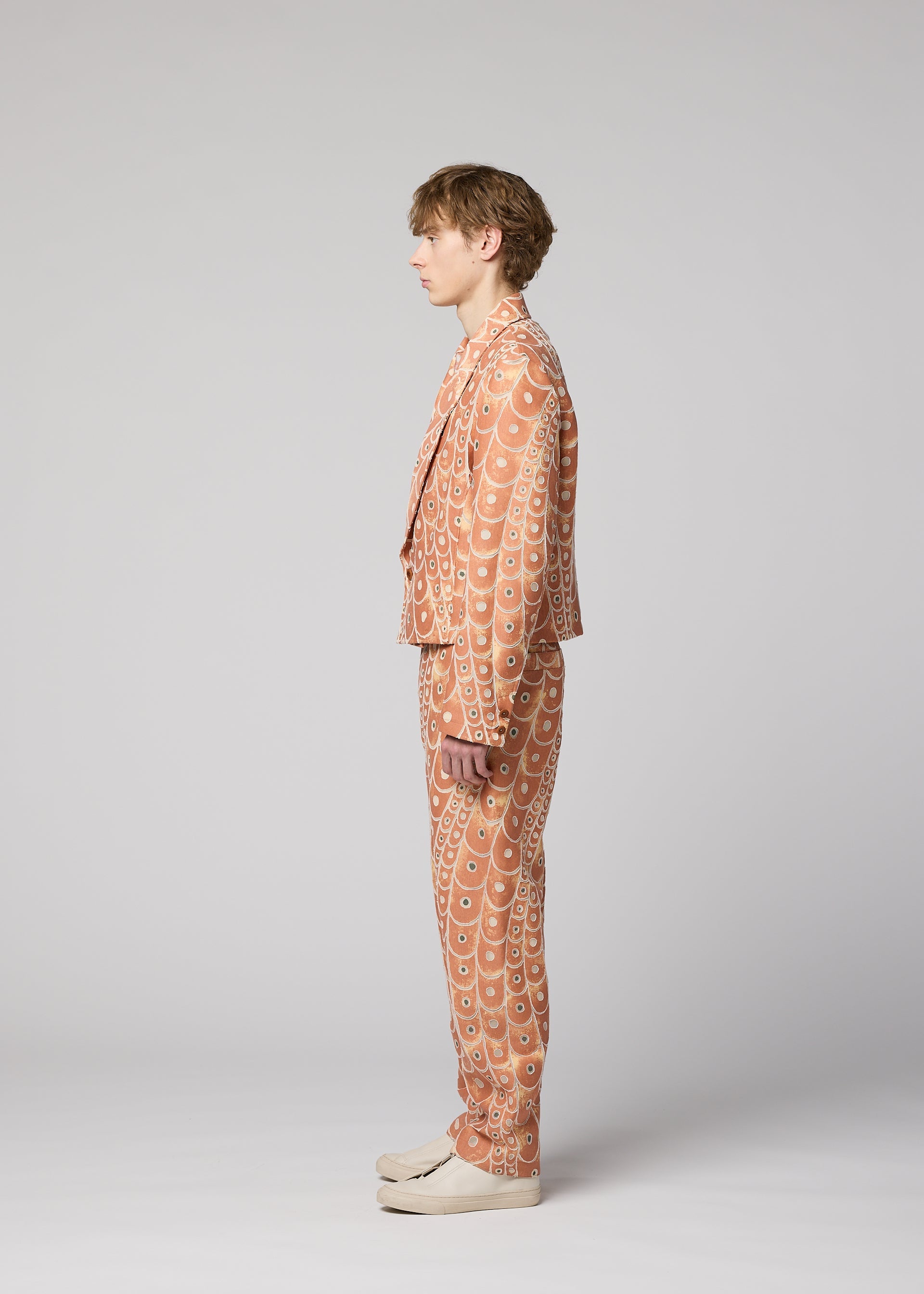 A model wears the IM MEN UROKOMON trousers.