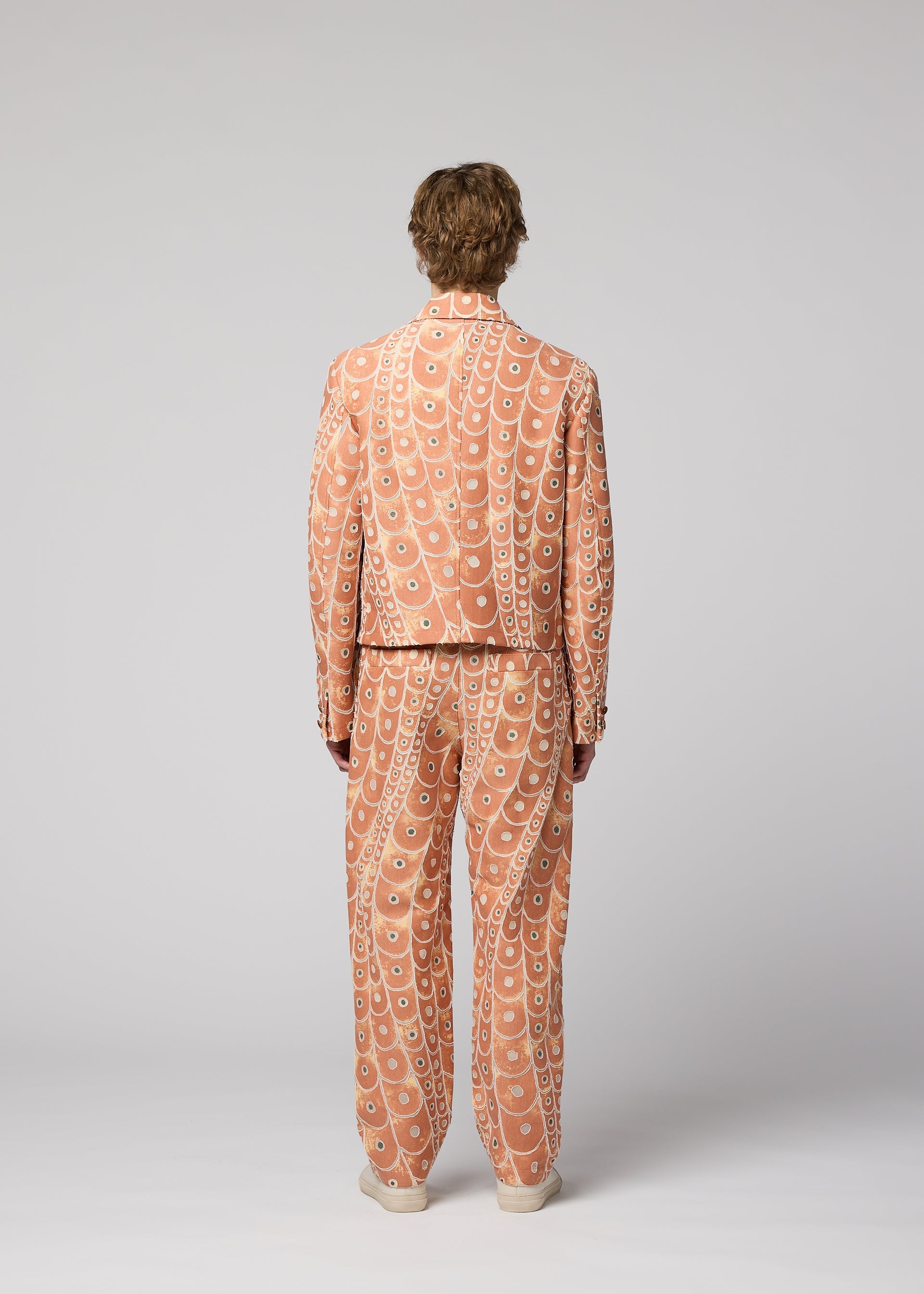 A model wears the IM MEN UROKOMON trousers.