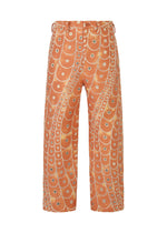 A product shot of the IM MEN UROKOMON trousers in red (24).