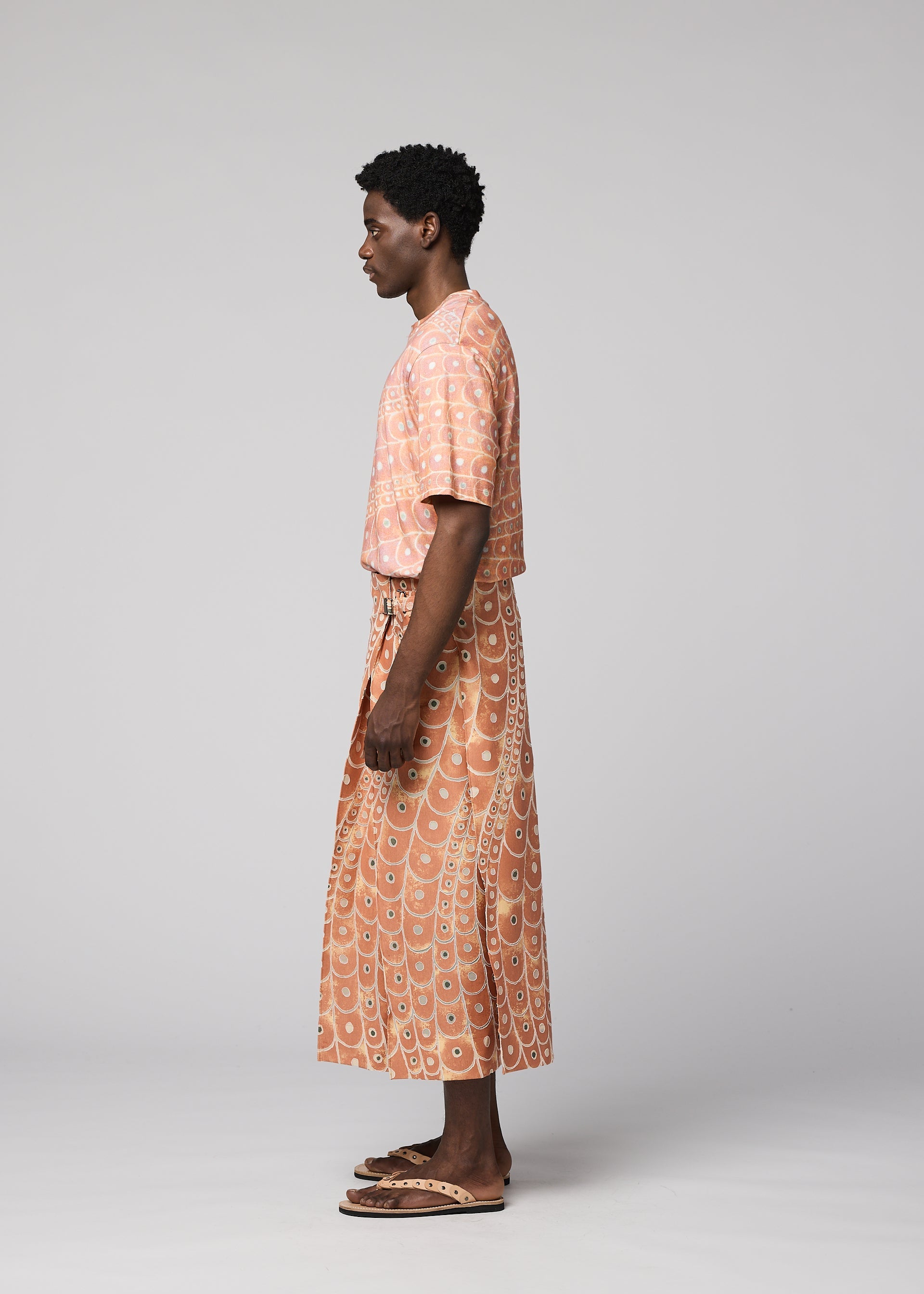 A model wears the IM MEN UROKOMON trousers.