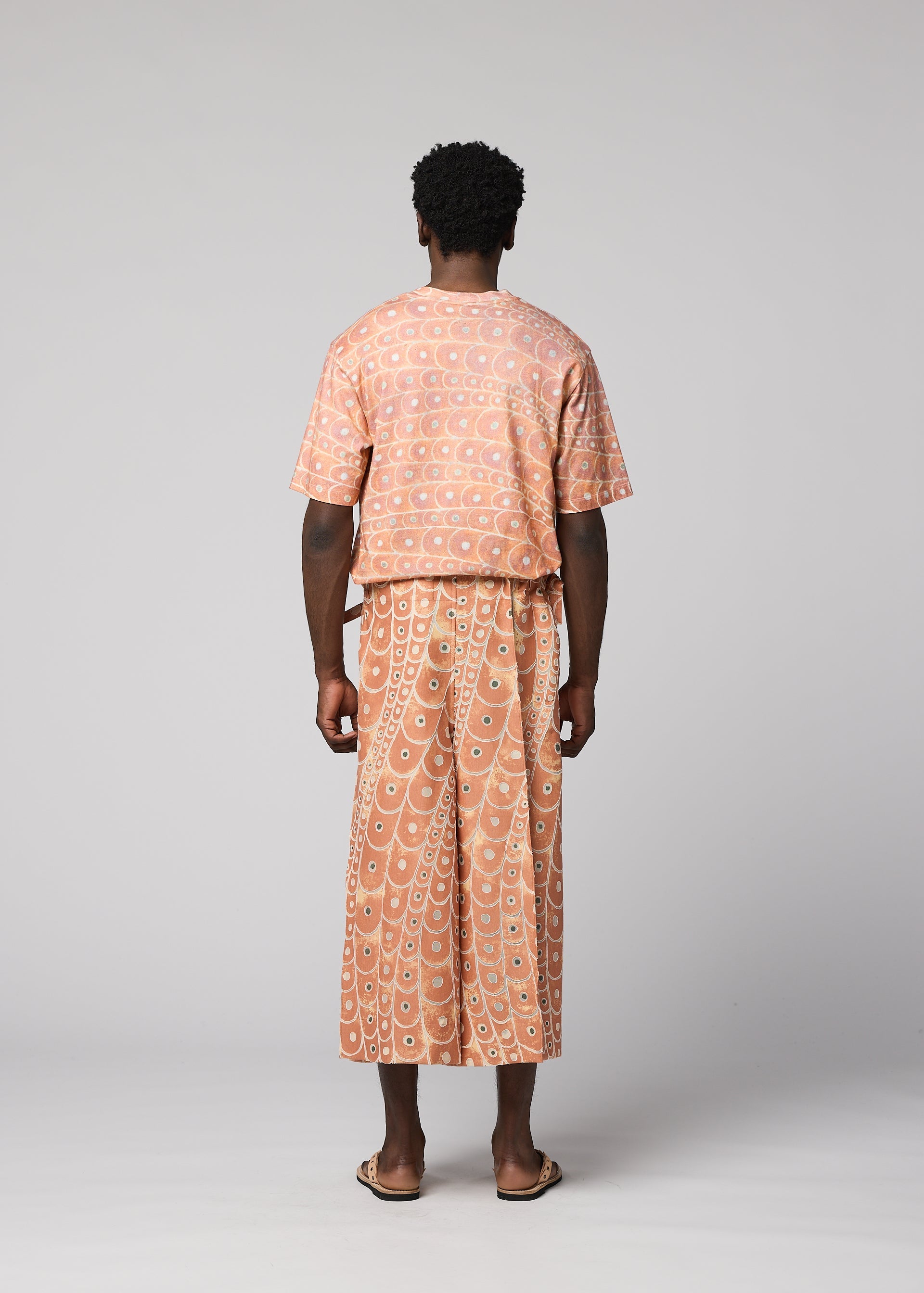 A model wears the IM MEN UROKOMON trousers.