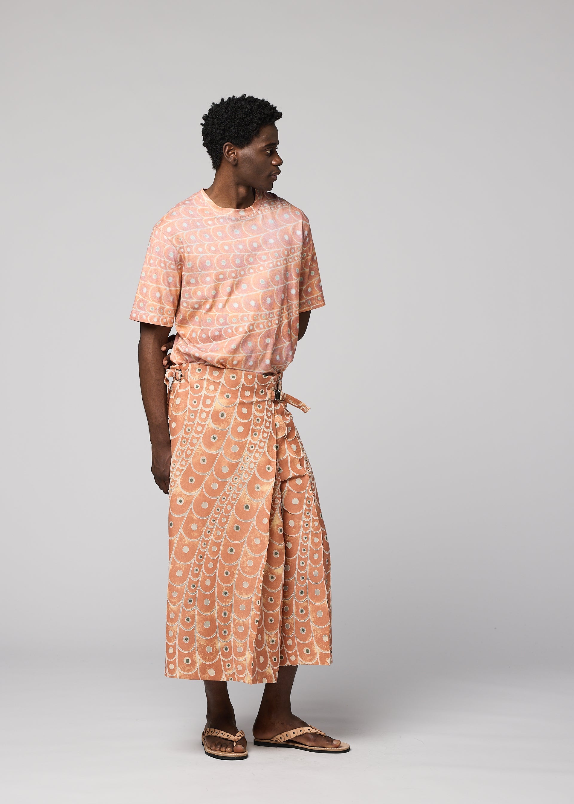 A model wears the IM MEN UROKOMON trousers.