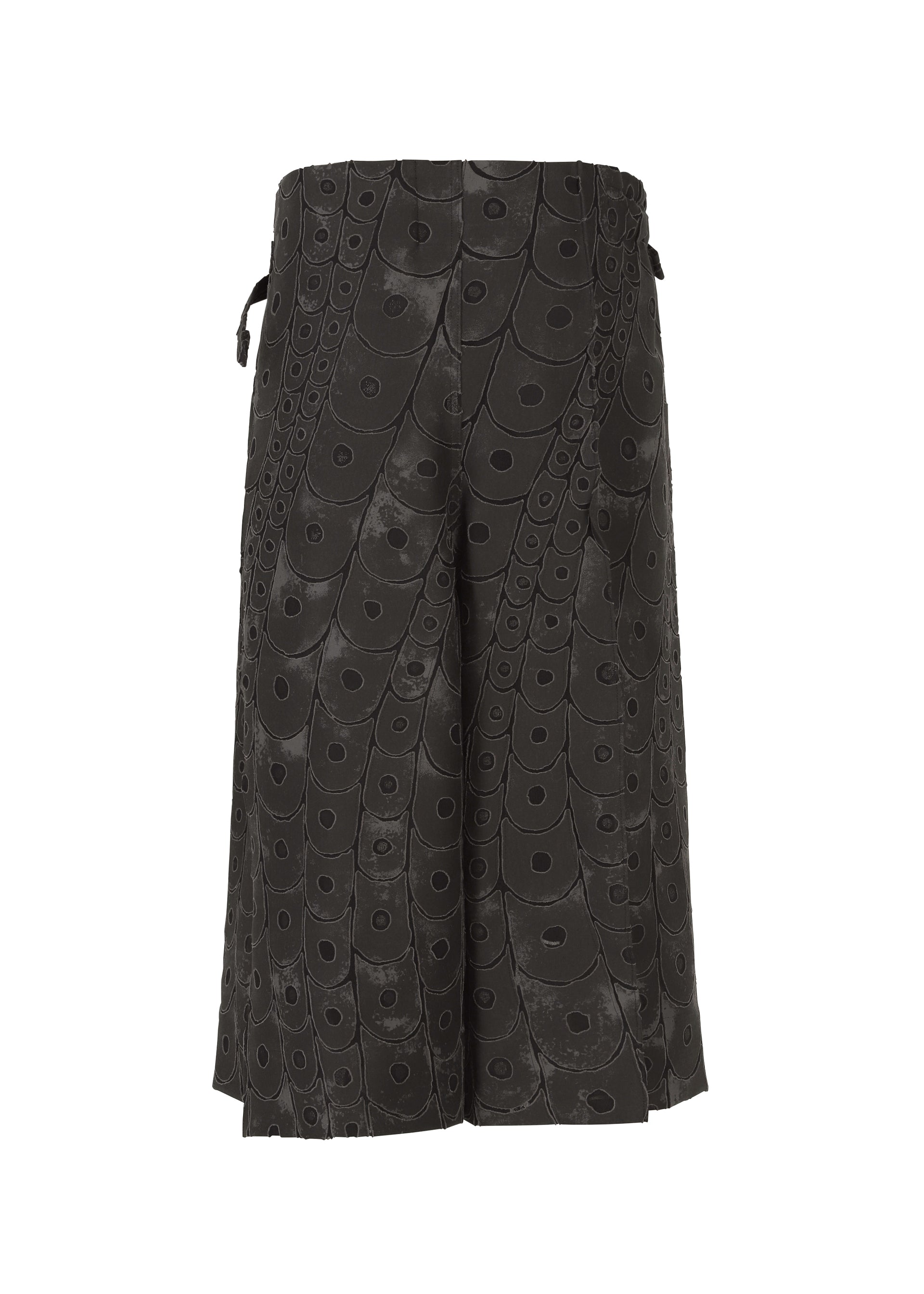 A detail shot of the IM MEN UROKOMON trousers.