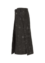 A detail shot of the IM MEN UROKOMON trousers.