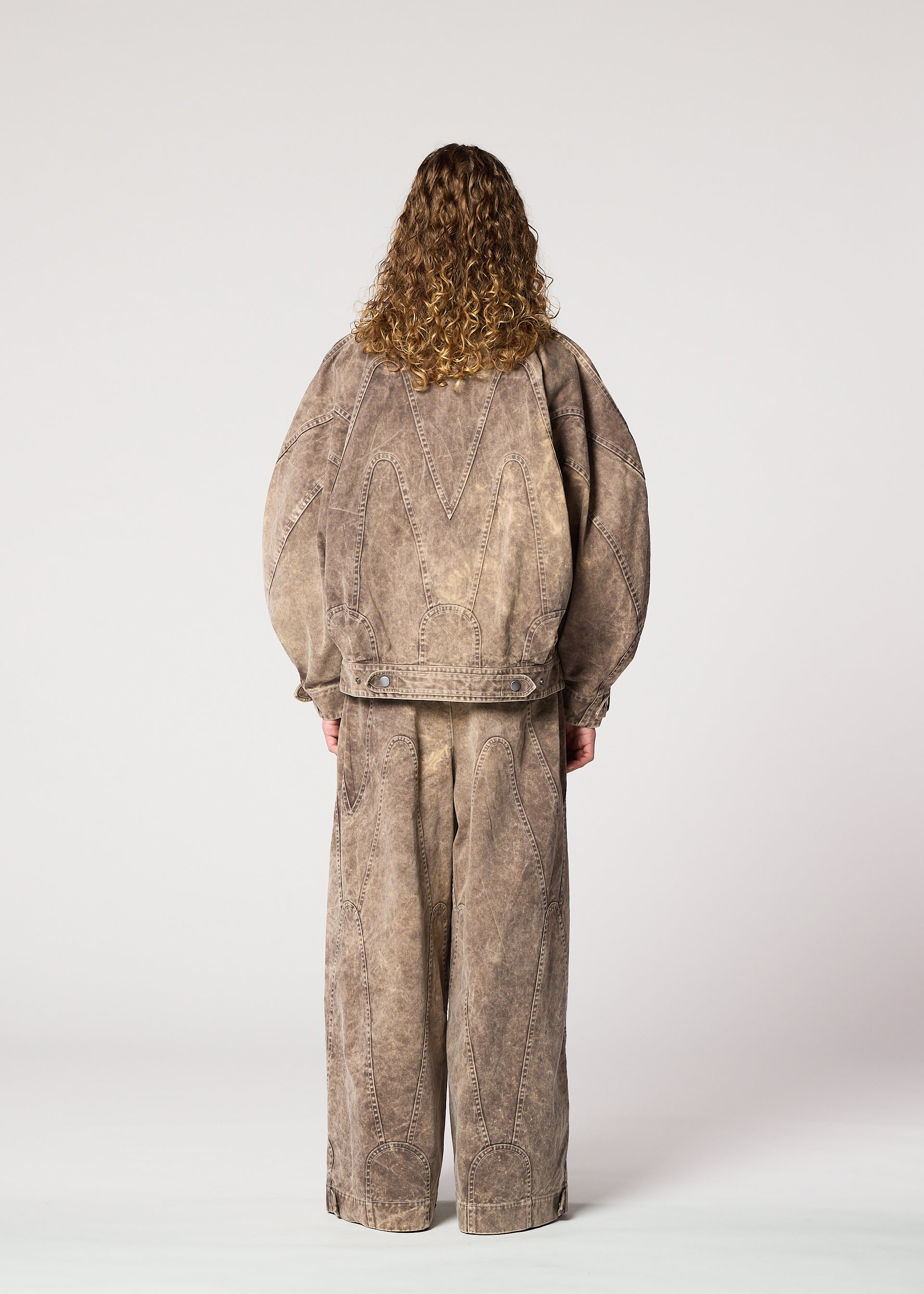 A model wears the IM MEN ELEMENTS trousers.