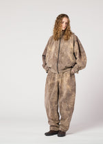 A model wears the IM MEN ELEMENTS trousers.