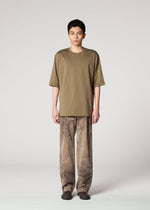 A model wears the IM MEN ELEMENTS trousers.