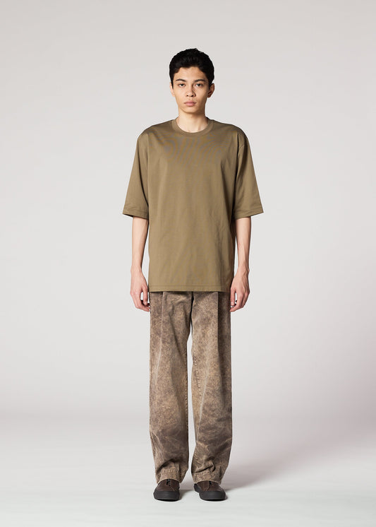 A model wears the IM MEN ELEMENTS trousers.