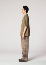 A model wears the IM MEN ELEMENTS trousers.