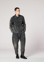 A model wears the IM MEN ELEMENTS trousers.