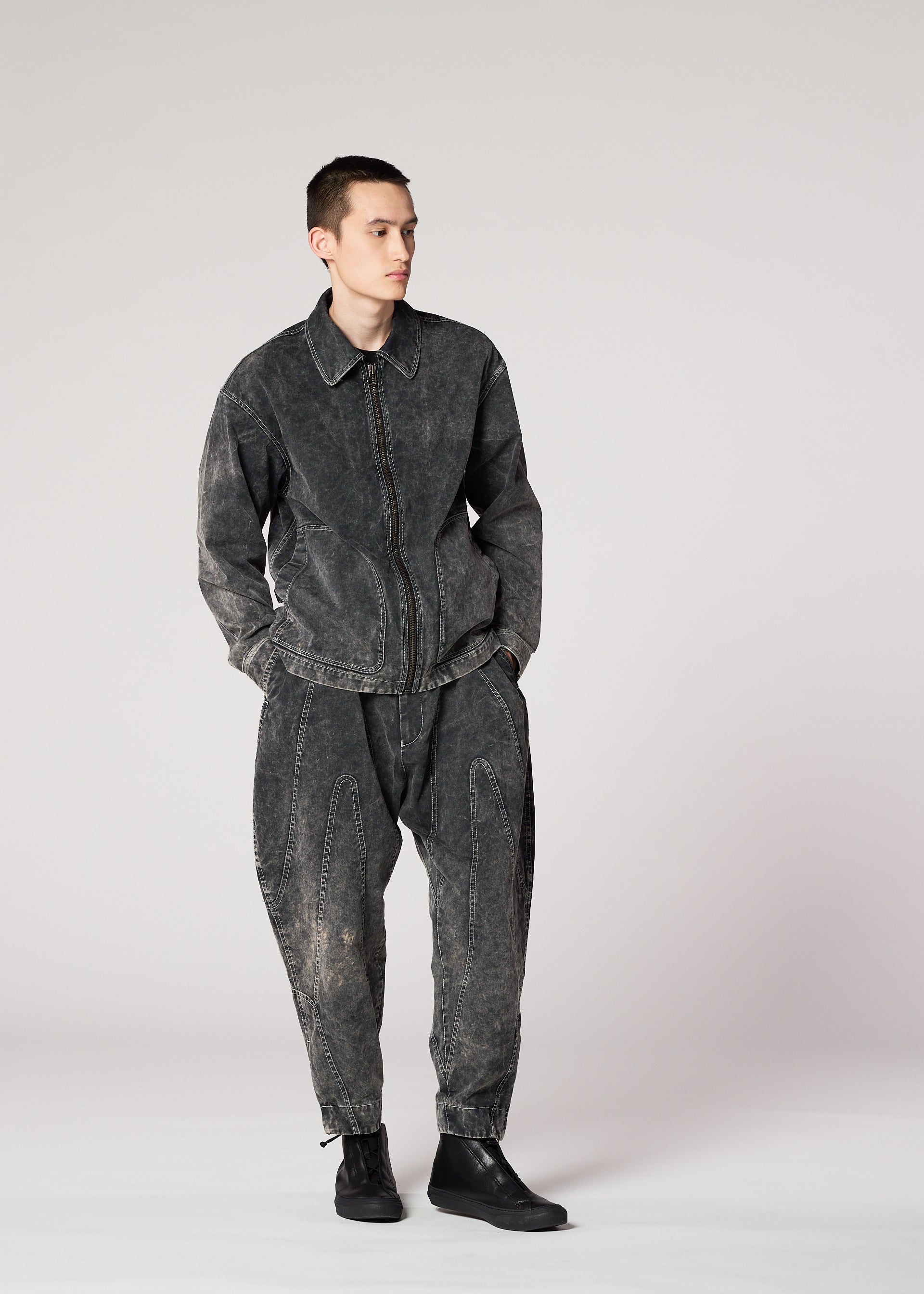 A model wears the IM MEN ELEMENTS trousers.