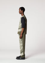 A model wears the IM MEN KAIYU trousers.