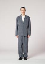 A model wears the IM MEN AIR WASH air-wash-trousers-grey.