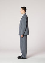 A model wears the IM MEN AIR WASH air-wash-trousers-grey.