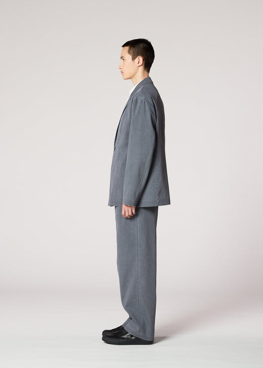 A model wears the IM MEN AIR WASH air-wash-trousers-grey.