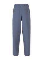 A detail shot of the IM MEN NAVY BOTTOMS trousers.