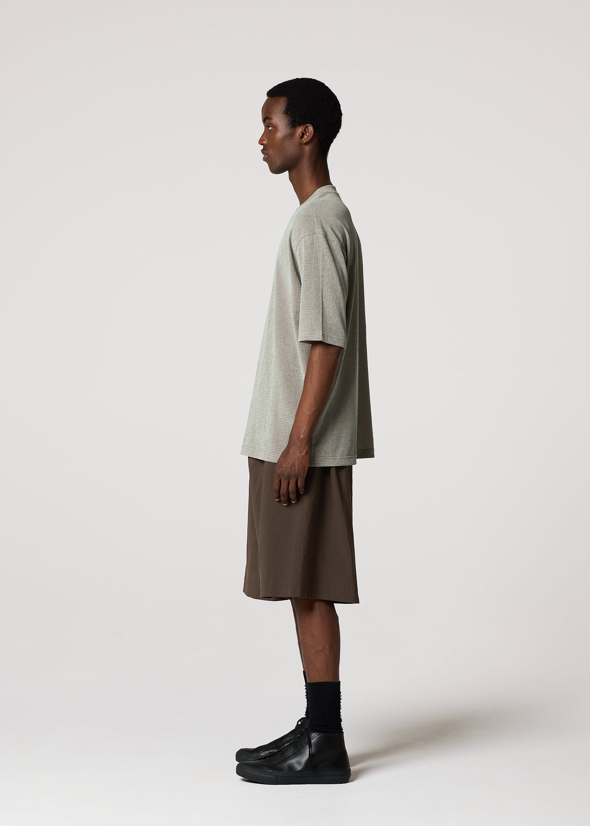 A model wears the IM MEN NAVY BOTTOMS navy-bottoms-trousers-light-grey-1.