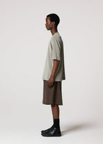 A model wears the IM MEN NAVY BOTTOMS navy-bottoms-trousers-dark-brown-1.