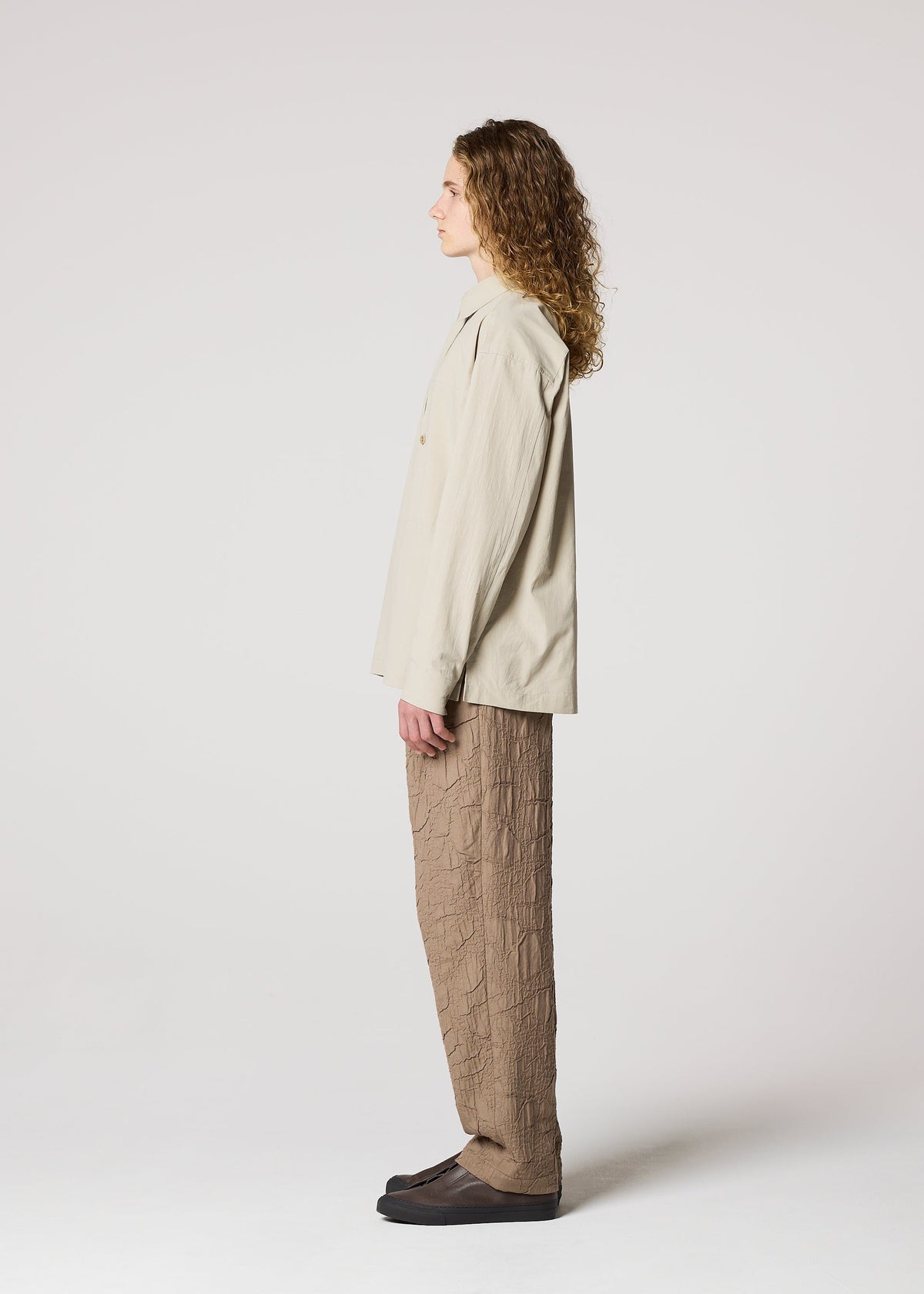 A model wears the IM MEN WHITE SHIRT clothing.