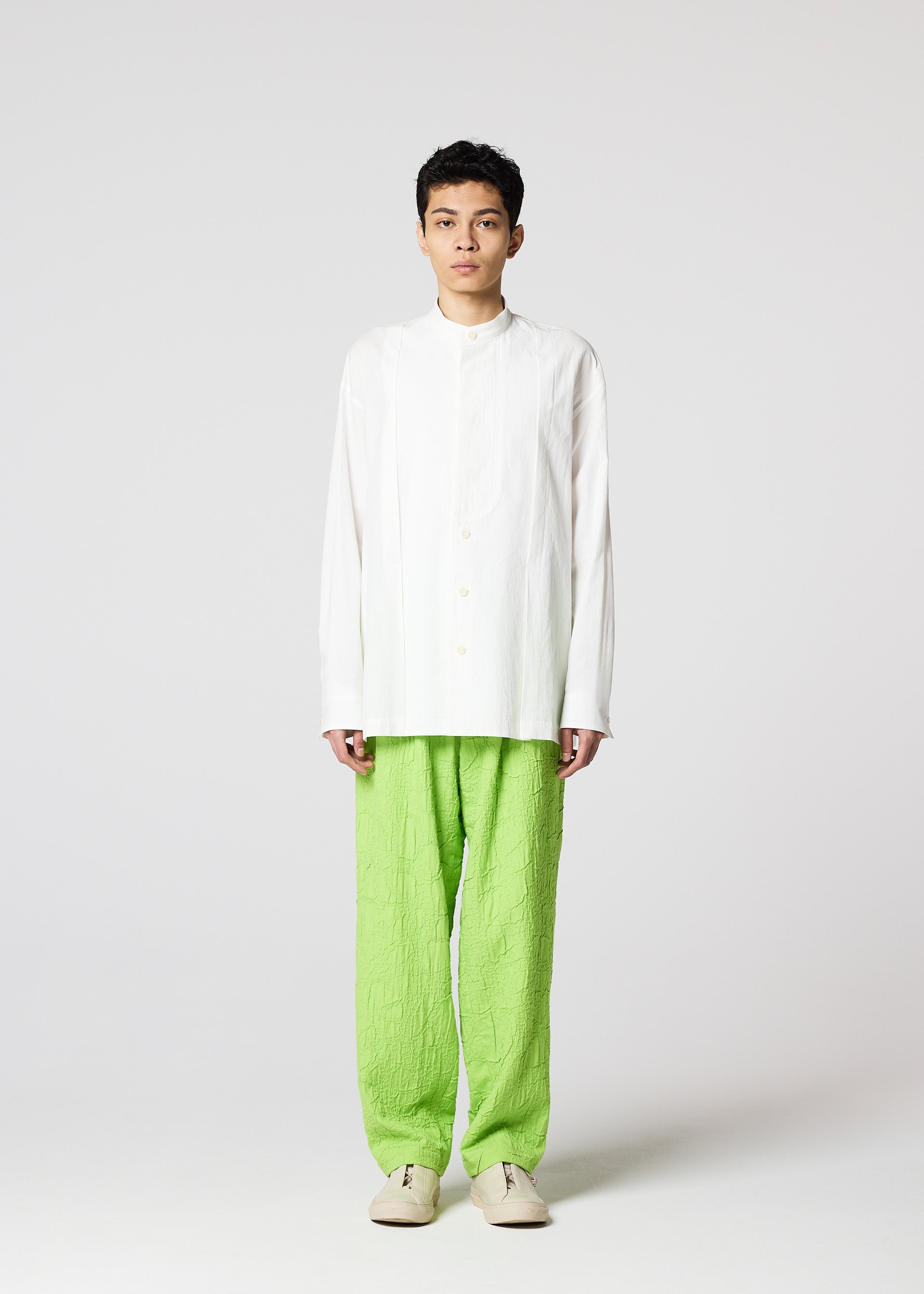 A model wears the IM MEN WHITE SHIRT clothing.