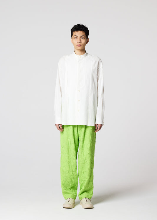 A model wears the IM MEN WHITE SHIRT clothing.